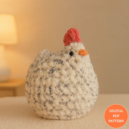 Knitted chicken toy with a digital PDF pattern label on a soft background